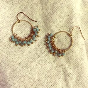 Gold base earrings with light blue beads